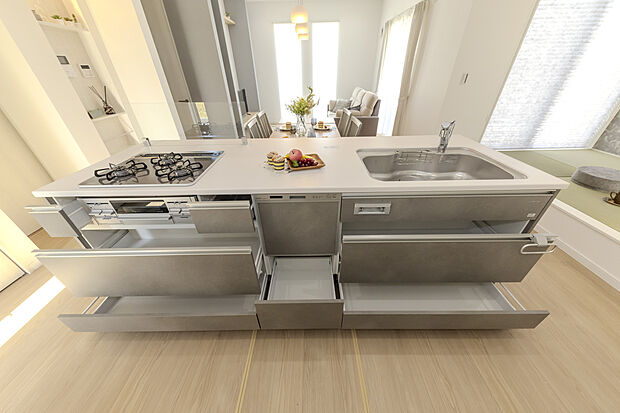 【【キッチン/施工例】】食器洗乾燥機や3口ガスコンロ、グリルを搭載した、使い勝手の良いシステムキッチンです。収納はスライド式の引き出しなので、大型の鍋類など奥に収納したものが取り出しやすい仕様です。