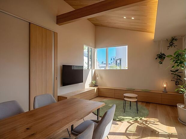 【5号地イメージパース】
リビング・ダイニング。作り付けのベンチ型の収納棚にはお子様のオモチャやブランケットなどを収納できます。(実際に家具は配置されておりません)