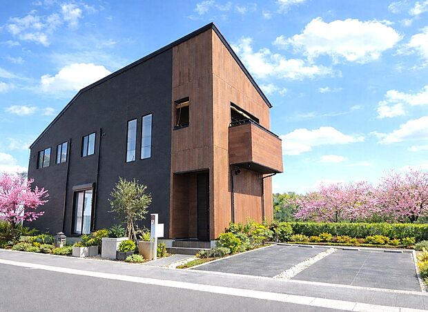 外観施工例　レオ・オートクチュール住宅　自由設計 建物価格1540万円、建物面積92.74m2　木の温もりと黒の重厚感が調和する、街並みに映えるモダン邸宅。