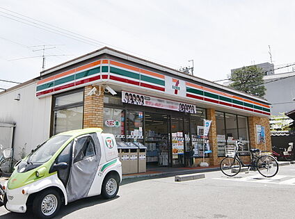 セブンイレブン向日梅ノ木店 約600ｍ(徒歩8分)