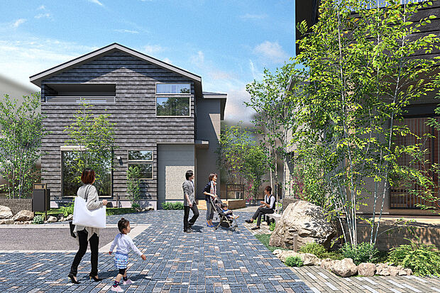 敷地の一部をシェアし、庭の緑に囲まれたオープンスペースを創出するコミュニティタウン。