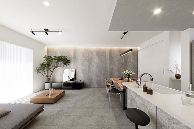 【〈PLAN01：ステージリビングのある家〉】リビングの一角に段差を設けて空間をゾーニングし、掘り机スタイルのカウンターをしつらえました。