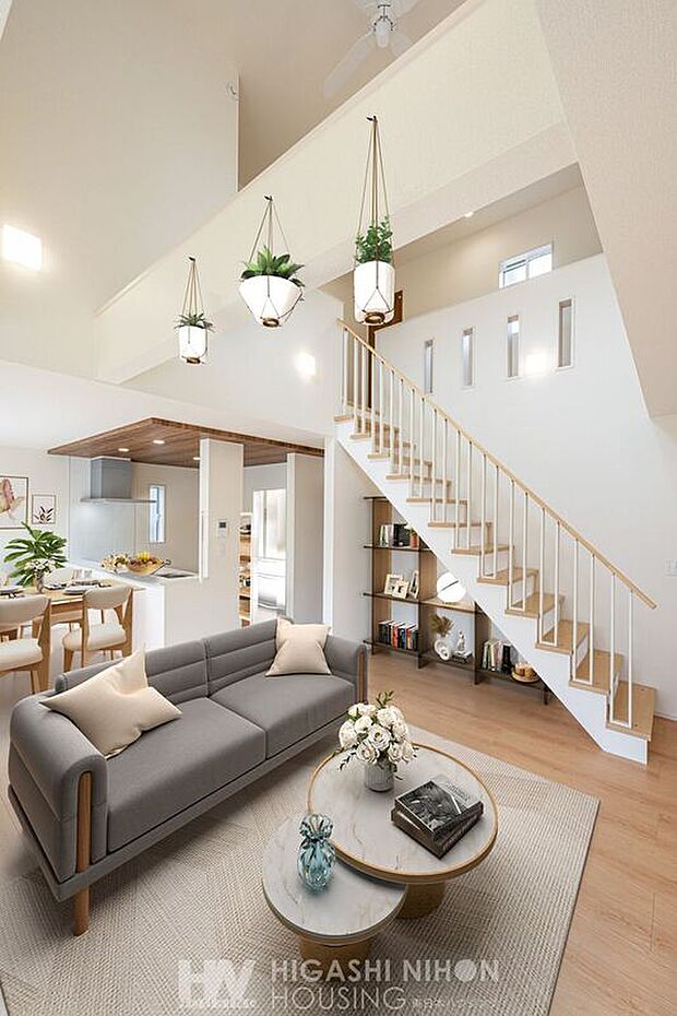 【建物プラン例　（パース・内観）】施工例（リビング）天井まで抜ける吹き抜けが、空間にのびやかな開放感をもたらします。たっぷりと差し込む陽光が心地よく、季節の移ろいを感じながら過ごせる明るい住まいです。