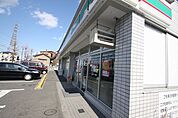 ローソンストア100西区比良店 72m