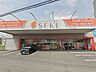 周辺：ドラッグストア 130m ドラッグストアセキ三郷早稲田店