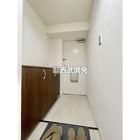 玄関 ライオンズマンション拝島 1階/-