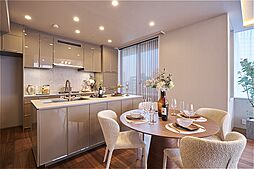 作業動線のよいアイランド型のII型キッチン。リビング・ダイニングに馴染む上品なカラーリングです。食器洗乾燥機・浄水器・ディスポーザーを搭載しています。