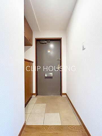 玄関 ドラゴンマンション多摩学園都市伍番館 10階/-