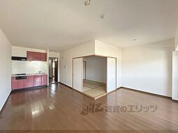 近鉄生駒線 一分駅 徒歩3分の賃貸マンション 3階2LDKのリビング/ダイニング