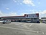 周辺：ドラッグストア 850m ドラッグストアセキ　愛宕店()