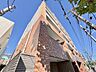 外観：レンガ調タイル張りの集合住宅外観