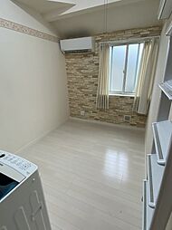 南太田レオン・ブルジョア 202 2階ワンルームのリビング/ダイニング